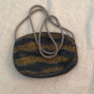 Vintage beaded clutch with zipper, perfect condition except for lipstick mark.